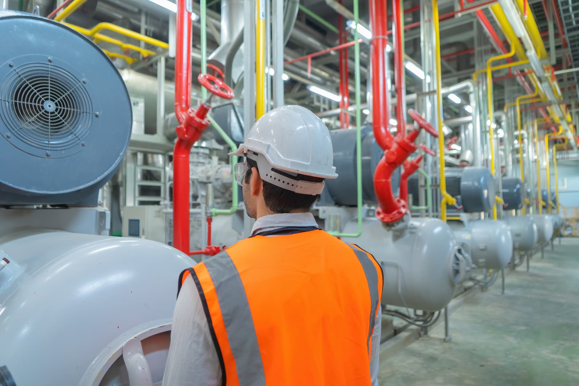 Saudi engineers reviewing workforce data on an industrial site